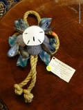 OUTER BANKS LOVE KNOT; KNOTTED ROPE WITH RIBBON, SHELLS AND A SAND DOLLAR IN THE MIDDLE. HAS