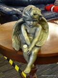 CHERUB ANGEL STATUE; BRASS COLORED HEAVY CHERUB ANGEL STATUE THAT SITS ON THE EDGE OF A TABLE OR