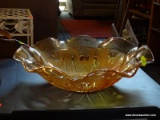 CARNIVAL GLASS BOWL;LARGE ORANGE CARNIVAL GLASS BOWL WITH SCALLOPED EDGES AND FLORAL DETAILING ON