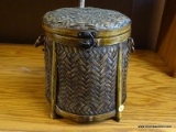 LIDDED BASKET; DRUM STYLE OVEN BASKET WITH SIDE HANDLES AND A FRONT LARCH. MEASURES 10.5IN X 10 IN