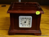 DESK ORGANIZER; CHERRY COLORED SQUARE DESK ORGANIZER WITH 4 DIVIDED AREAS AND A CLOCK ON THE FRONT.