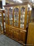 OAK CHINA CABINET; OAK CHINA CABINET WITH DENTAL MOLDING AROUND THE TOP AND 4 GLASS PANELED DOORS