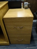 WOODEN FILING CABINET; WOOD GRAIN 2 DRAWER FILING CABINET WITH PLASTIC BROWN HANDLES. HAS A PENCIL