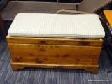 WOODEN BENCH WITH UNDER CHEST; WOODEN BENCH WITH UNDER CHEST AND A GREEN AND PINK PLAID FABRIC