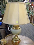 CERAMIC GOLD TONE TABLE LAMP; CERAMIC TABLE LAMP WITH GOLD TONE DETAILING ABOVE AND BELOW A WHITE