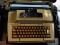 (UPBED) TYPEWRITER; VINTAGE ELECTRIC SMITH CORONA TYPEWRITER IN CASE