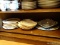 (DR) MISCELL. LOT (LEFT SIDE OF SIDEBOARD- BOTTOM SHELF)- LOT INCLUDES LARIAT PATTERN DIVIDED DISH,