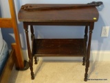 (BED2) VINTAGE TABLE; VINTAGE MAHOGANY TABLE WITH LOWER BOOK RACK- 25 IN X 12 IN X 26 IN AND