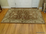 (FOYER) RUG; MACHINE MADE ORIENTAL STYLE RUG IN BROWN, BEIGE AND MAROON- 4 FT. X 6 FT.