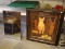 (GARAGE) FRAMED CAT PRINT; PRINT SHOWS A CAT SITTING AMONG BOOKS ON A SHELF. FRAMED IN A BROWN