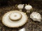 (KIT) LIMOGE PLATTER AND PLATES; SET OF 4 SMALL LIMOGE GOLD AND FLORAL PLATES WITH MATCHING PLATTER.