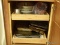 (KIT) CABINET LOT; LOT INCLUDES PLASTIC MEASURING CUPS, A BUNDT PAN, LOAF PANS, A CHEESE GRATER,