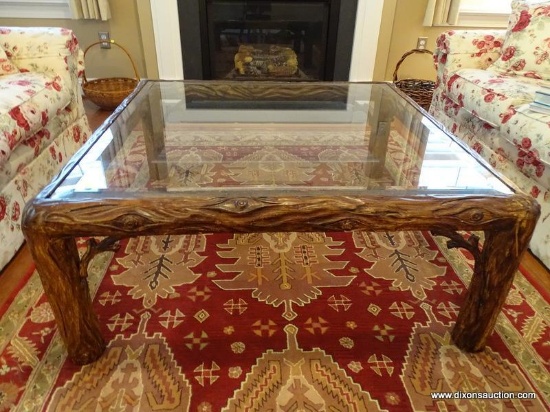 (LR) COFFEE TABLE; LARGE COMPOSITION TREE PATTERNED COFFEE TABLE WITH 1.5 IN BEVELED GLASS TOP- 42