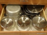 (KIT) DRAWER LOT; LOT INCLUDES ASSORTED POTS AND PANS. SOME HAVE LIDS.
