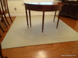 (DR) AREA RUG; CREAM COLORED MACHINE MADE AREA RUG.