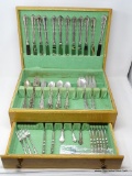 84 PIECES OF INTERNATIONAL STERLING FLATWARE; ANGELIQUE PATTERN. (12) STERLING HANDLED STAINLESS