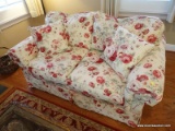 (LR) LOVESEAT; ONE OF A PR. OF FLORAL UPHOLSTERED LOVESEATS IN EXCELLENT CONDITION-62 IN X 38 IN X