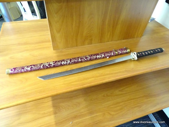 JAPANESE KATANA; SAMURAI SWORD WITH A WOODEN SHEATH ENVELOPED BY A PINK CLOTH WITH ORIENTAL GOLD