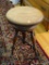 (LR) WOODEN STOOL ON A SWIVEL; WOOD GRAIN STOOL THAT SITS ON A SWIVEL WITH 4 OUTER LEGS AN 1 MIDDLE