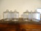 (DR) LOT OF LARGE GLASS JARS; 6 PIECE LOT OF LARGE GLASS JARS WITH LIDS. MEASURES 10 IN TALL WITH A