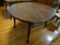 (DR) WALNUT ROUND KITCHEN TABLE; ROUND KITCHEN TABLE WITH 1 LEAF AND 4 TAPERED LEGS WITH PAD FEET.