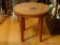 (DR) WOODEN STOOL; WOOD GRAIN STOOL WITH AN OVAL SEAT AND 4 CABRIOLE SQUARE LEGS. MEASURES 17.25 IN