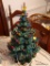(DR) GLASS CHRISTMAS TREE; ELECTRIC GLASS CHRISTMAS TREE WITH CONTROLLABLE LIGHTS. MEASURES 10 IN
