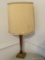 (DR) WOODEN TABLE LAMP; ROUND WOODEN TABLE LAMP SITTING ON A SQUARE METAL BASE. COMES WITH A LIGHT