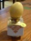 (DR) MARBLE EGG IN STAND; YELLOW MARBLE EGG SITTING ON A WHITE STAND THAT HAS 