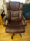 (OFC) FAUX LEATHER EXECUTIVE CHAIR; BROWN FAUX LEATHER ROLLING EXECUTIVE CHAIR. MEASURES 2 FT 4 IN X