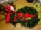 (OFC) HOLIDAY/CHRISTMAS WREATH; ARTIFICIAL EVERGREEN WREATH WITH RED BOW ON THE FRONT.