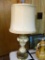 (DNRM) CHERUB TABLE LAMP; CREAM COLORED SHADE ON AN INTRICATE CREAM AND GOLD TONE, PIERECED BODY