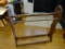 (FOYER) WOODEN QUILT RACK; WOOD GRAIN QUILT RACK WITH BRACKET DETAILED SIDES. MEASURES 33 IN X 9 IN