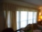 (LR) WINDOW CURTAINS; CREAM AND WHITE COLORED CURTAINS WITH SHELL DETAILED TOP AND 2 LAYERS OF