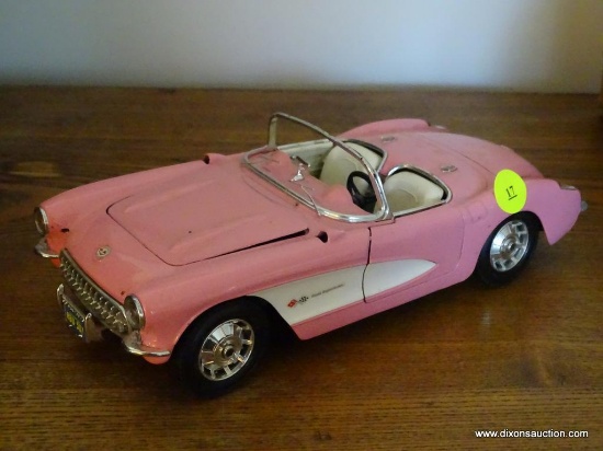 (LR) CHEVROLET CORVETTE MODEL CAR; BURAGO 1957 PINK CHEVROLET CORVETTE 1/18 SCALE MODEL CAR.