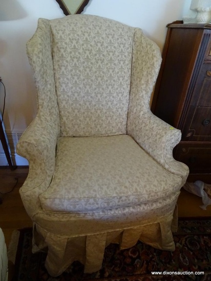 (LR) WINGBACK ARMCHAIR; ARMCHAIR WITH A WINGBACK SITTING ON CABRIOLE LEGS AND CLUB FEET. COMES WITH