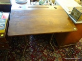 (LR) WOODEN LIFT TOP DESK; WOOD GRAIN DESK WITH A LIFT TOP DESK THAT LEADS TO A METAL STORAGE