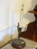 (DR) TABLE LAMP CANDLE; TABLE LAMP FAKE CANDLE WITH A METAL HANDLE MOUNTED ON A WOODEN BLOCK.