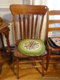 (DR) BANNISTER BACK CHAIR; WOODEN BANNISTER BACK CHAIR WITH HAND KNITTED SEAT TOPPERS. SITS ON 4
