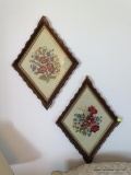 (LR) LOT OF NEEDLEPOINT FRAMED PICTURES; 2 DIAMOND SHAPED FLOWER NEEDLE POINTS SITTING IN A WOODEN