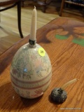 (DR) DECORATIVE EGG WITH CANDLE; LARGE PALE YELLOW EGG WITH PASTEL FLOWERS AND A CANDLE.