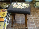 (DNRM) NEEDLEPOINT OTTOMAN/ STOOL; DARK BROWN FLORAL NEEDLEPOINT TOP SITTING ON 4 WOODEN QUEEN ANNE