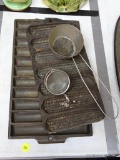 (DNRM)LOT OF CAST IRON; LOT INCLUDES A CAST IRON CORN COB TRAY, A SECTIONED TRAY, AND A WIRE MESH