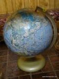 (DNRM) WORLD GLOBE; SPINNING GLOBE ON A METAL AXIS AND STAND. MEASURES 16 IN TALL.