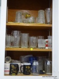 (KIT) CABINET LOT; LOT INCLUDES VARIOUS DRINKING GLASSES AND MUGS.