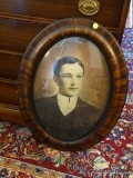 (LR) ANTIQUE OVAL SHAPED PHOTO; OVAL SHAPED ANTIQUE FAMILY PHOTO IN A BEAUTIFUL WOODEN GLASS FRAME