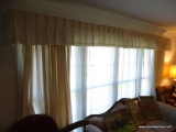 (LR) WINDOW CURTAINS; CREAM AND WHITE COLORED CURTAINS WITH SHELL DETAILED TOP AND 2 LAYERS OF