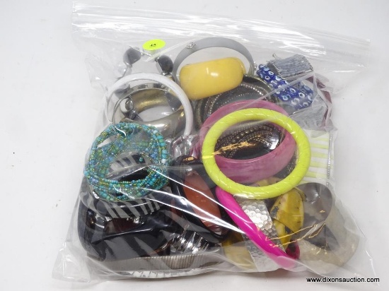 LOT OF ASSORTED COSTUME BANGLES; LARGE BAG OF UNRESEARCHED COSTUME BANGLES MADE FROM PLASTIC, METAL,