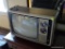 (UPMR) VINTAGE RCA TELEVISION; BRUSHED SILVER AND WOODGRAIN RCA XL-100 WITH ANTENNA, AND TWO FRONT