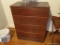 (UPSIT) CHEST OF DRAWERS; CHERRY STAINED WOODEN CHEST OF DRAWERS WITH 4 DRAWERS THAT HAVE BRASS